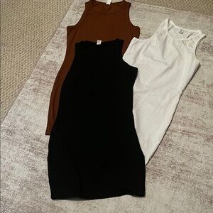Elegant Black, White, and Brown Sleeveless Dresses